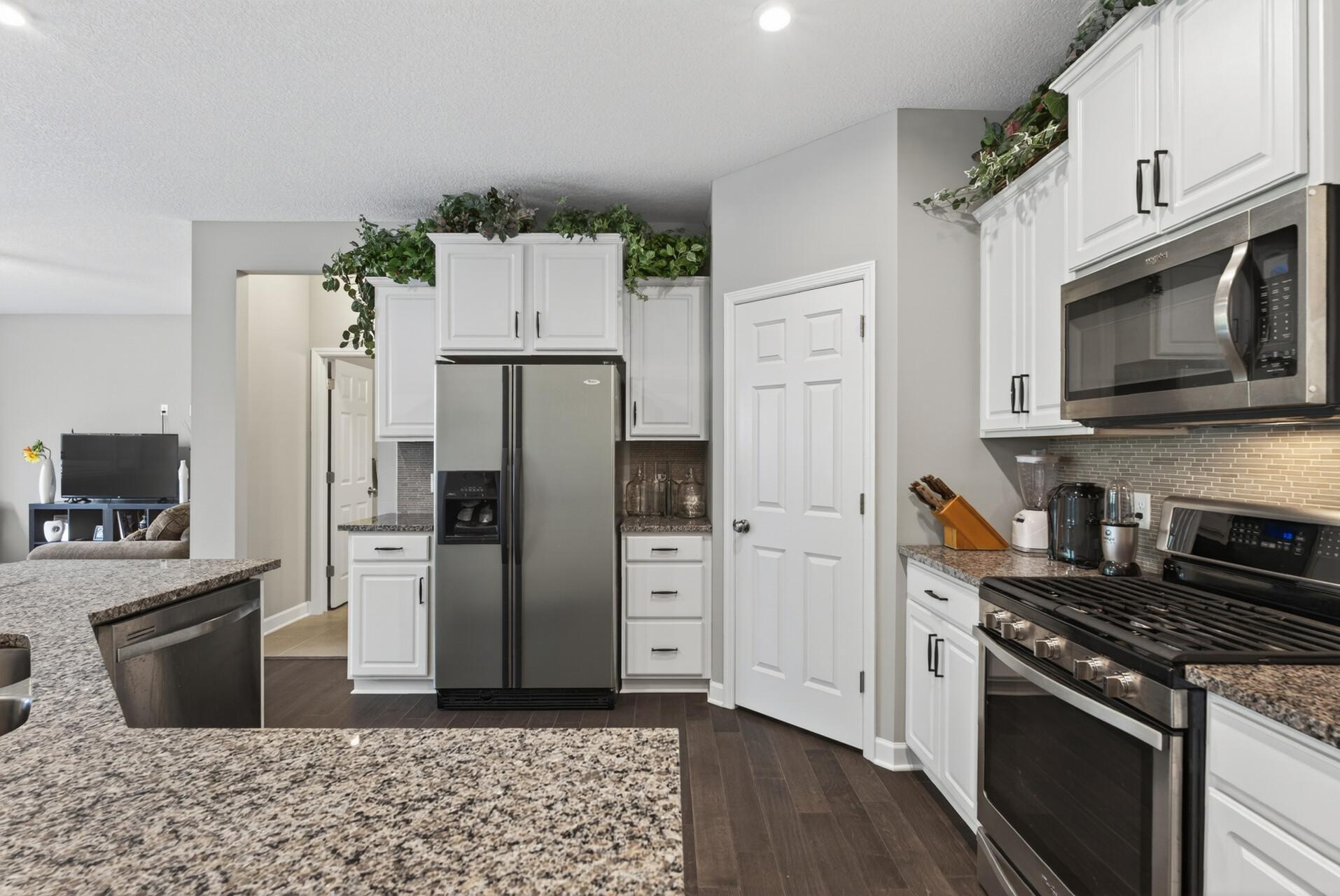 Stainless steel appliances create a clean, cohesive look that is easy to maintain.