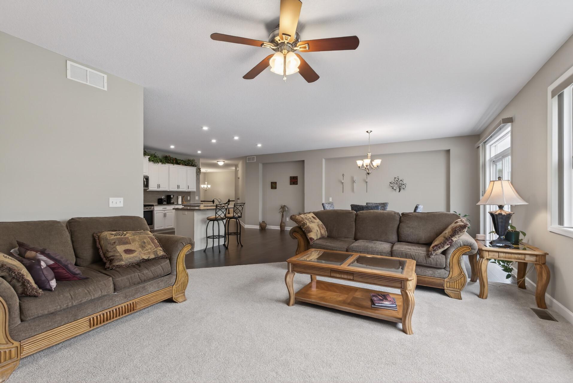 Recessed lighting and large windows ensure this space is bright and inviting.