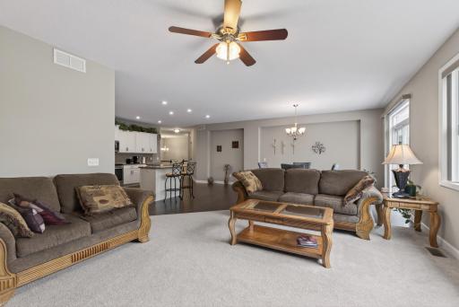 Recessed lighting and large windows ensure this space is bright and inviting.