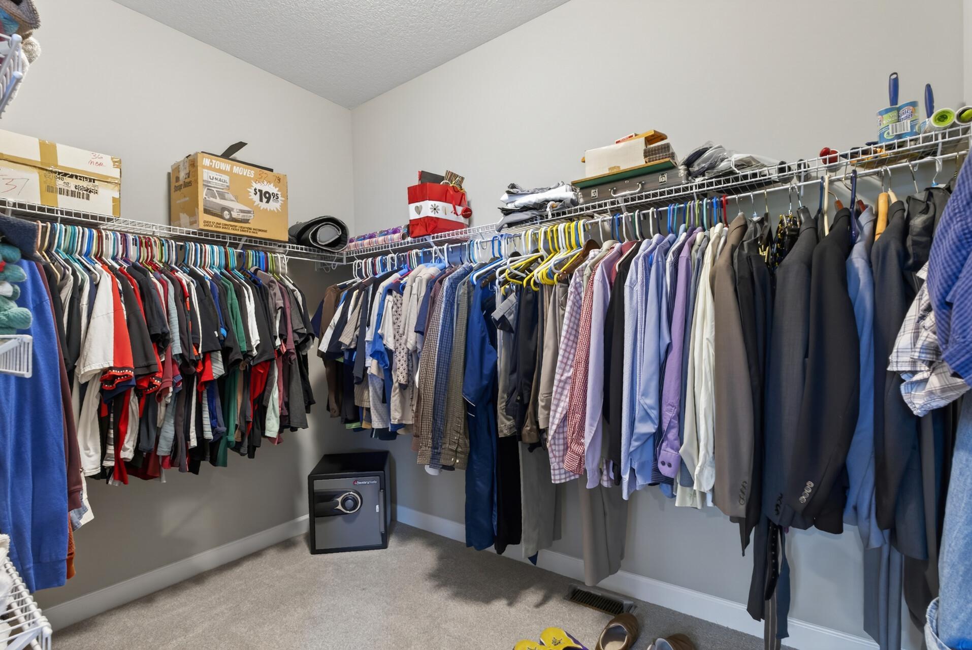 The large walk-in closet offers storage solutions for all your clothes!