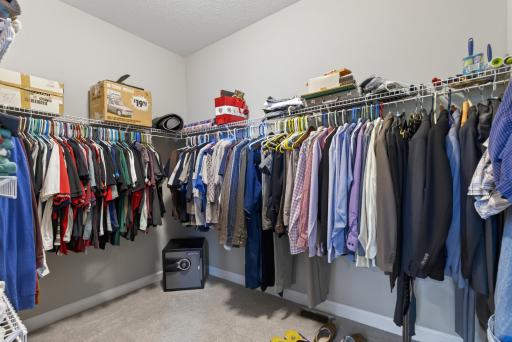 The large walk-in closet offers storage solutions for all your clothes!