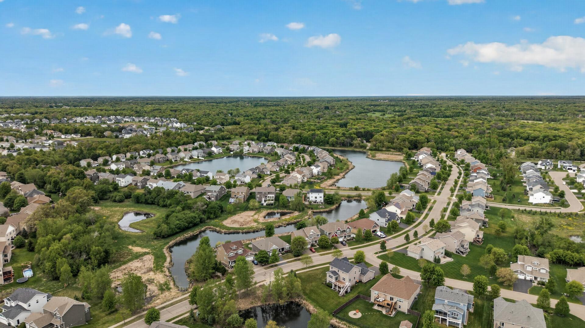 Nestled in an established neighborhood surrounded by mature trees and scenic ponds.
