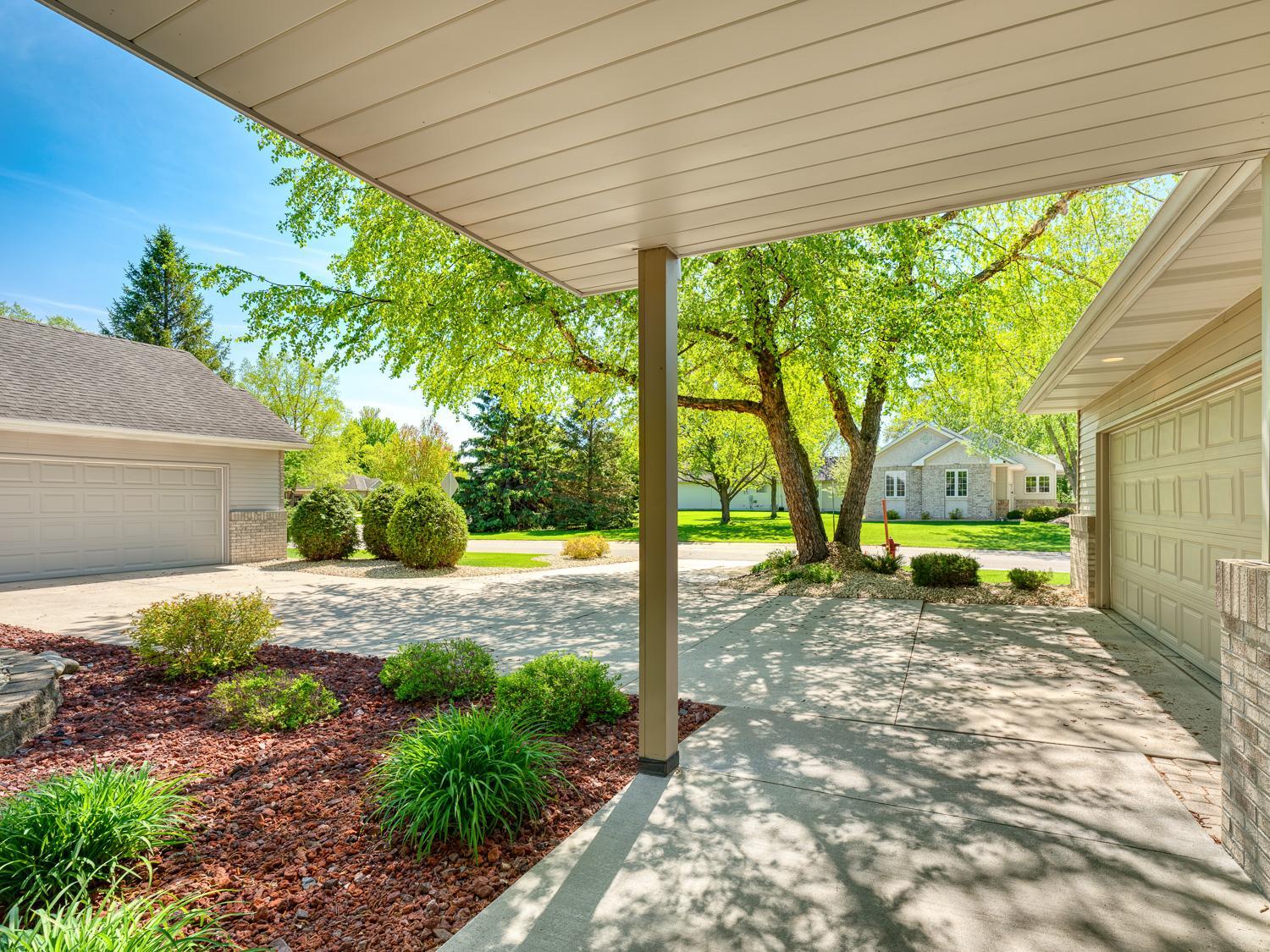 Beautiful landscaping add to the curb appeal of this home.