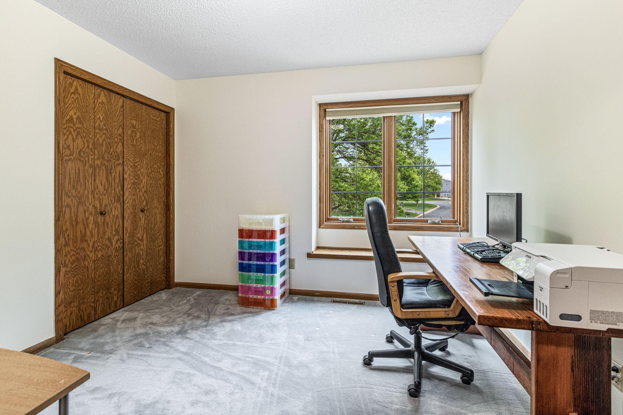 Upper Level - third bedroom with large window and closet