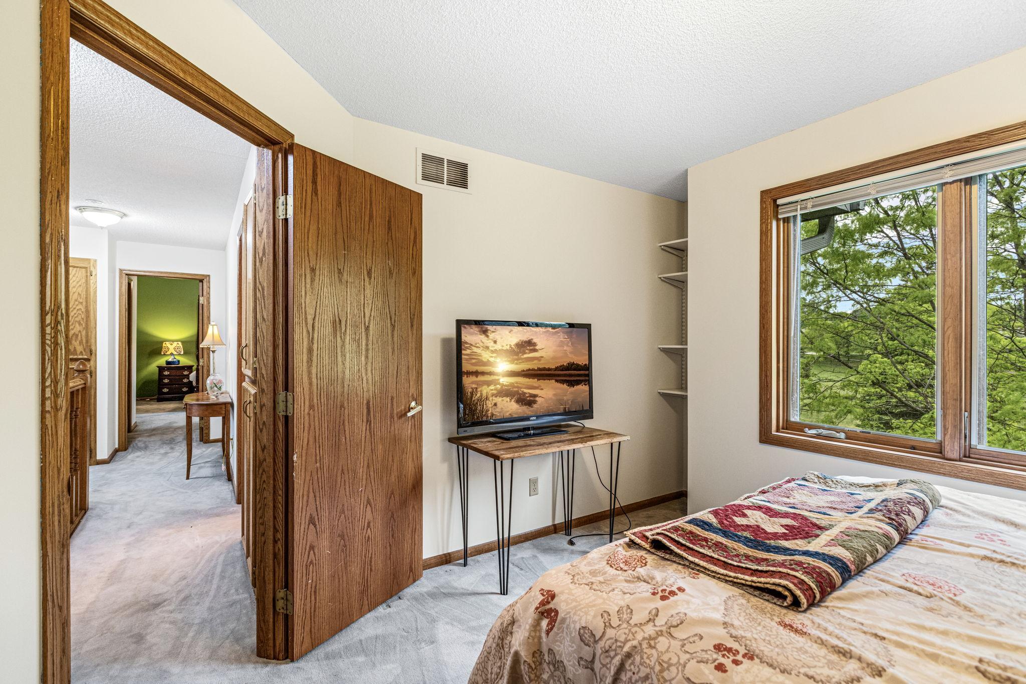 View of second bedroom and hallway