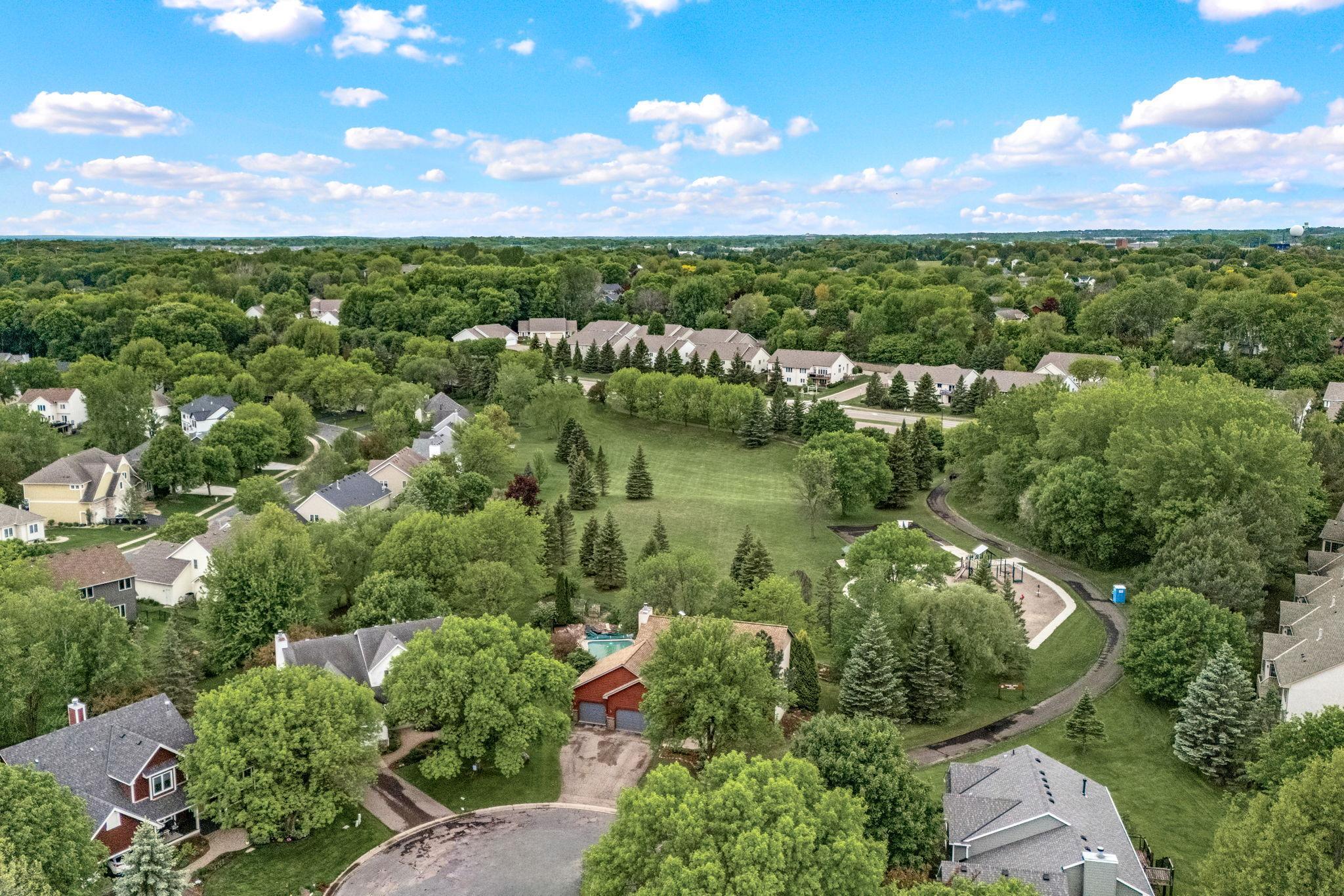 Look right behind the home at the open area behind the home. Great for privacy and fun area to run around.