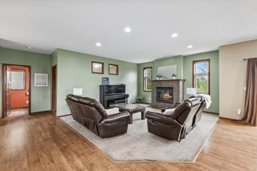 View of the living room from the kitchen. The main level 1/2 bath is to the left along with the main level bedroom.