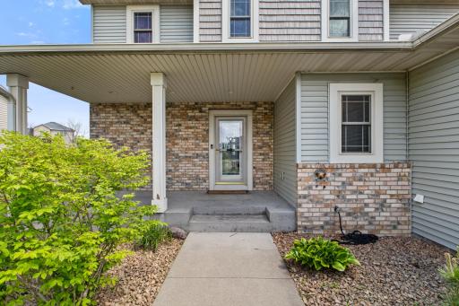 Inviting front walk way with easy to maintain landscaping.