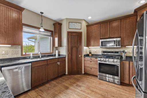 Warm and inviting tones and finishes throughout the home. The kitchen window overlooks the open field and faces south.