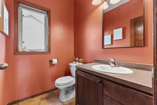 Main level 1/2 bath located off of the entry way and near the main level bedroom.