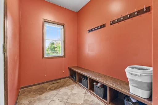 Mudroom that is west facing. The door to the garage is left of this photol