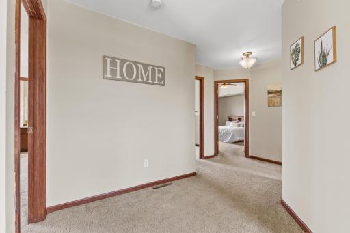 View from the upper level landing. 3 bedrooms, 2 bathrooms, and a laundry room.