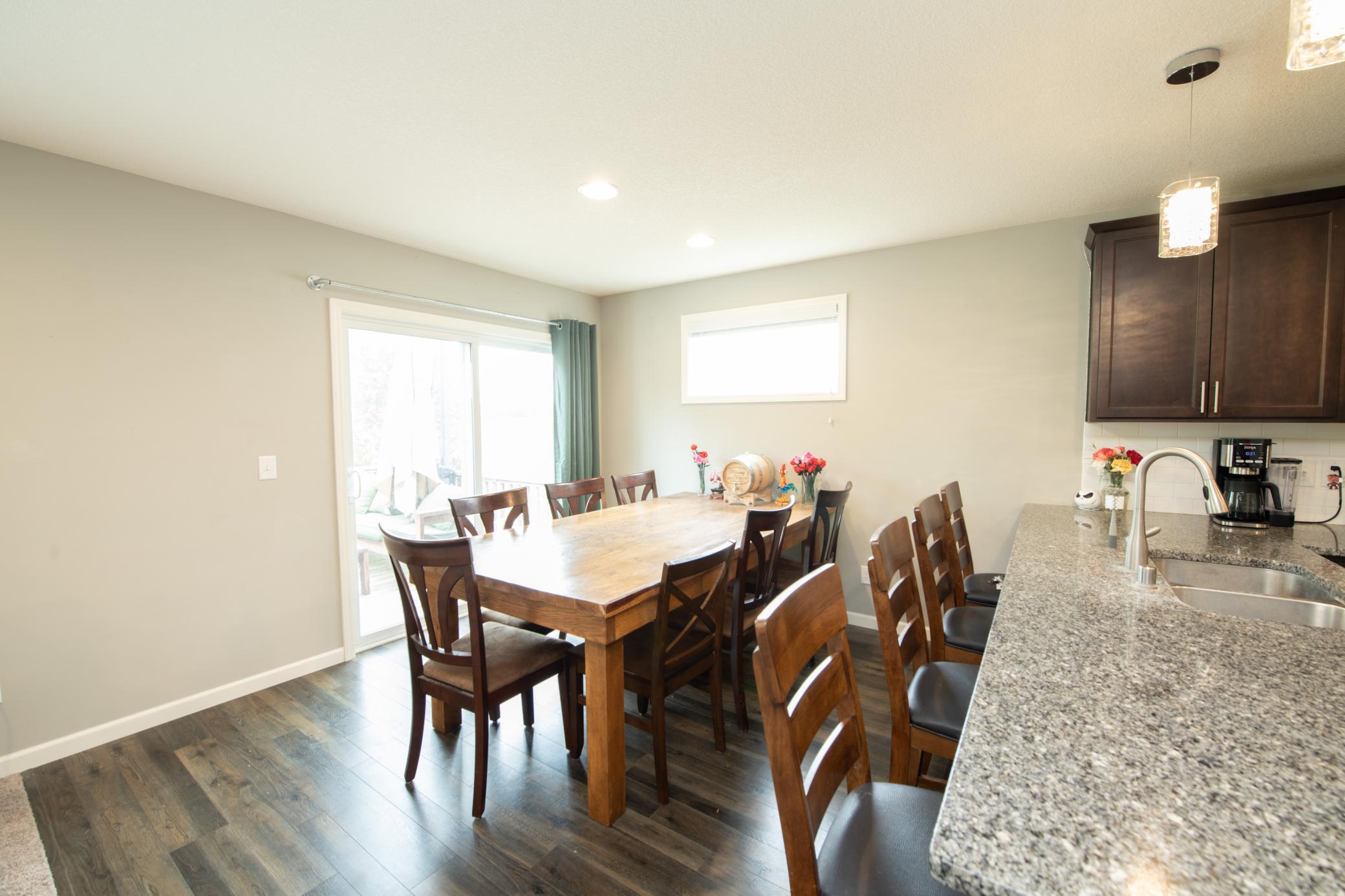 Dining area off of kitchen with walk out to deck area.jpg