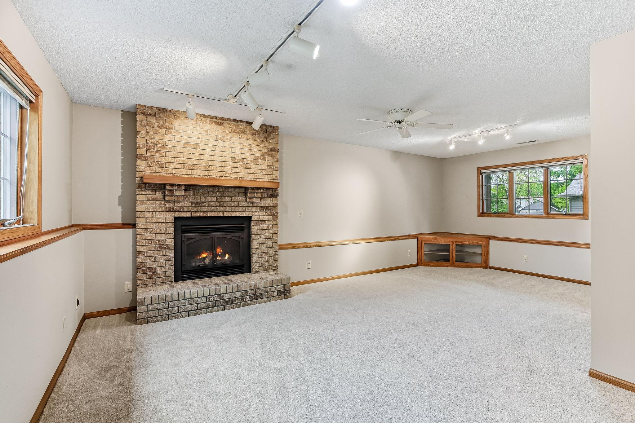 Cozy gas fireplace in the spacious lower level family room!