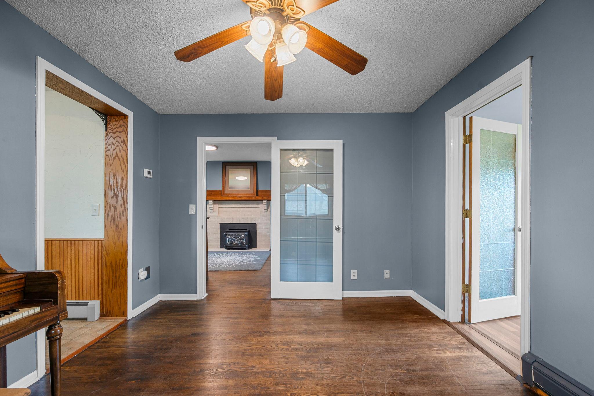 Stunning hardwood floors in the separate formal dining room between the kitchen and living room.