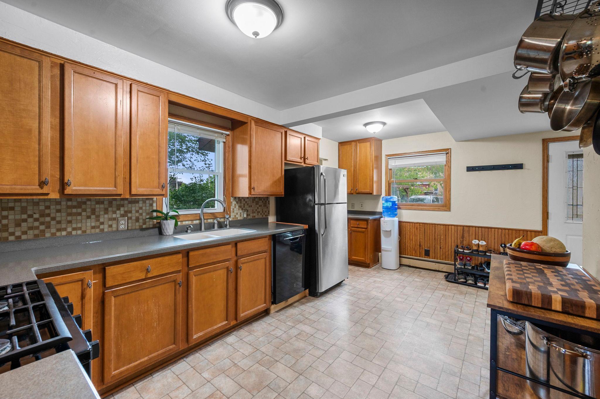 Kitchen has plenty of space for entertaining and could easily accommodate an eat-in dining area.