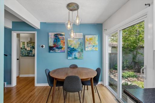 Informal dining off kitchen to back patio slider