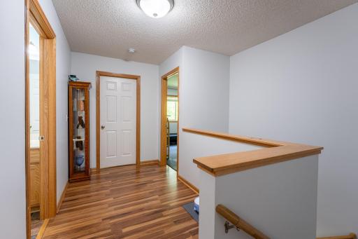 The second level features a spacious primary suite w/ walk-in closet & Â¾ bath, a second bedroom, full bath & laundry.