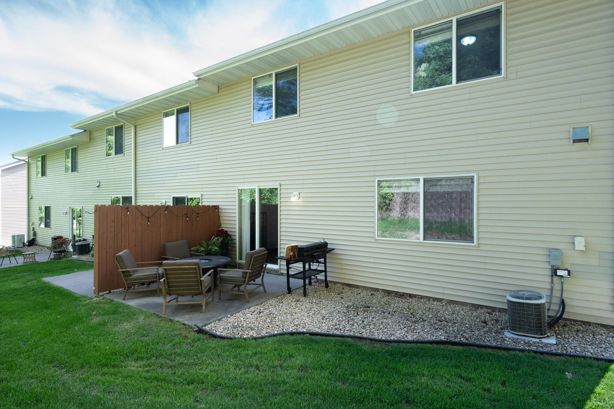 This 10x10 outdoor patio space is a rare find in a townhome! End unit, with the a beautiful bluff in your backyard. If you have been looking for an end unit townhome, with backyard privacy, this one is it! Schedule your private showing today!