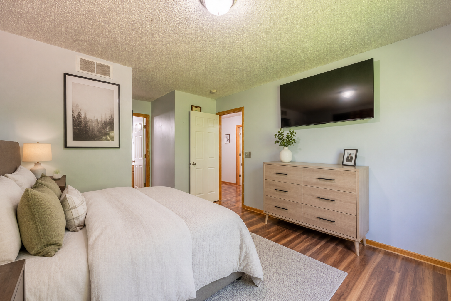 The primary bedroom virtually staged to show use as a bedroom.