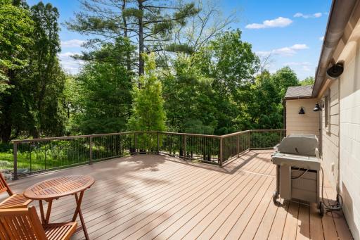 Surrounded by mature trees and landscaping