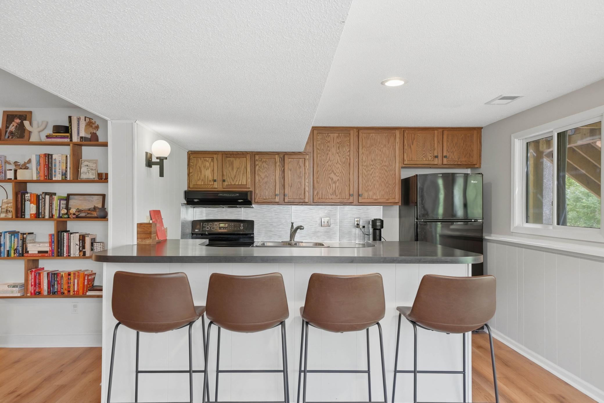 Full kitchen in lower level creates the opportunity for multi generational living or the perfect place to host / entertain