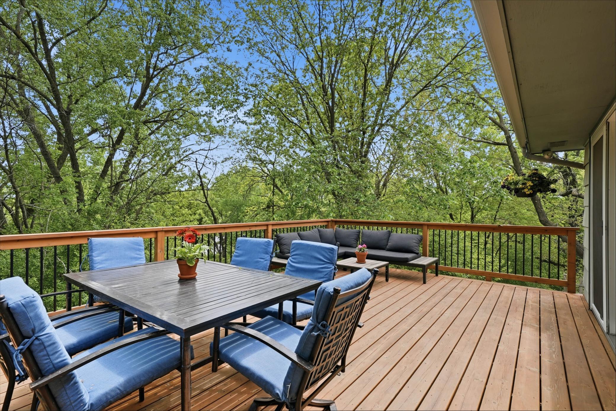 Back yard is a peacefully surrounded by a tree covered lot