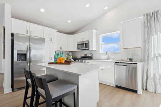 (Photo of decorated model, actual home's finishes will vary) This new two-story home showcases a modern design with a lower-level recreation room for versatility.