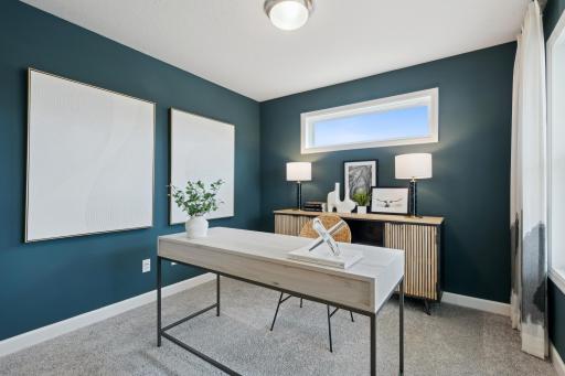 (Photo of decorated model, actual home's finishes will vary) A spacious flex room with gorgeous French doors is located at the foyer offering a nice work from home space, or a formal living room area.