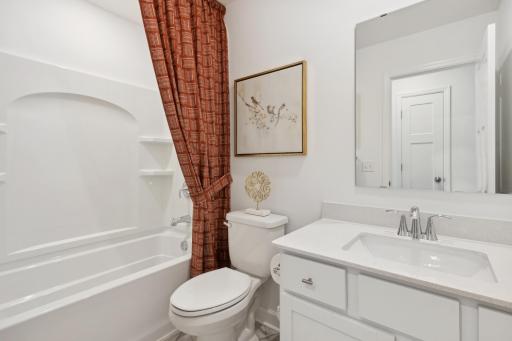 (Photo of decorated model, actual home's finishes will vary) A full bath located on the main floor!