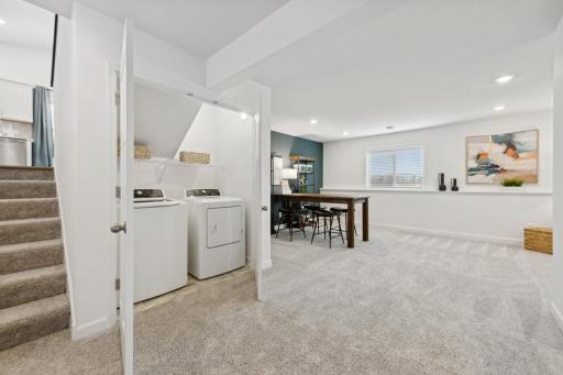 (Photo of decorated model, actual home's finishes will vary) Located in the optional finished basement is a laundry room to get chores finished and keep messes out of sight.