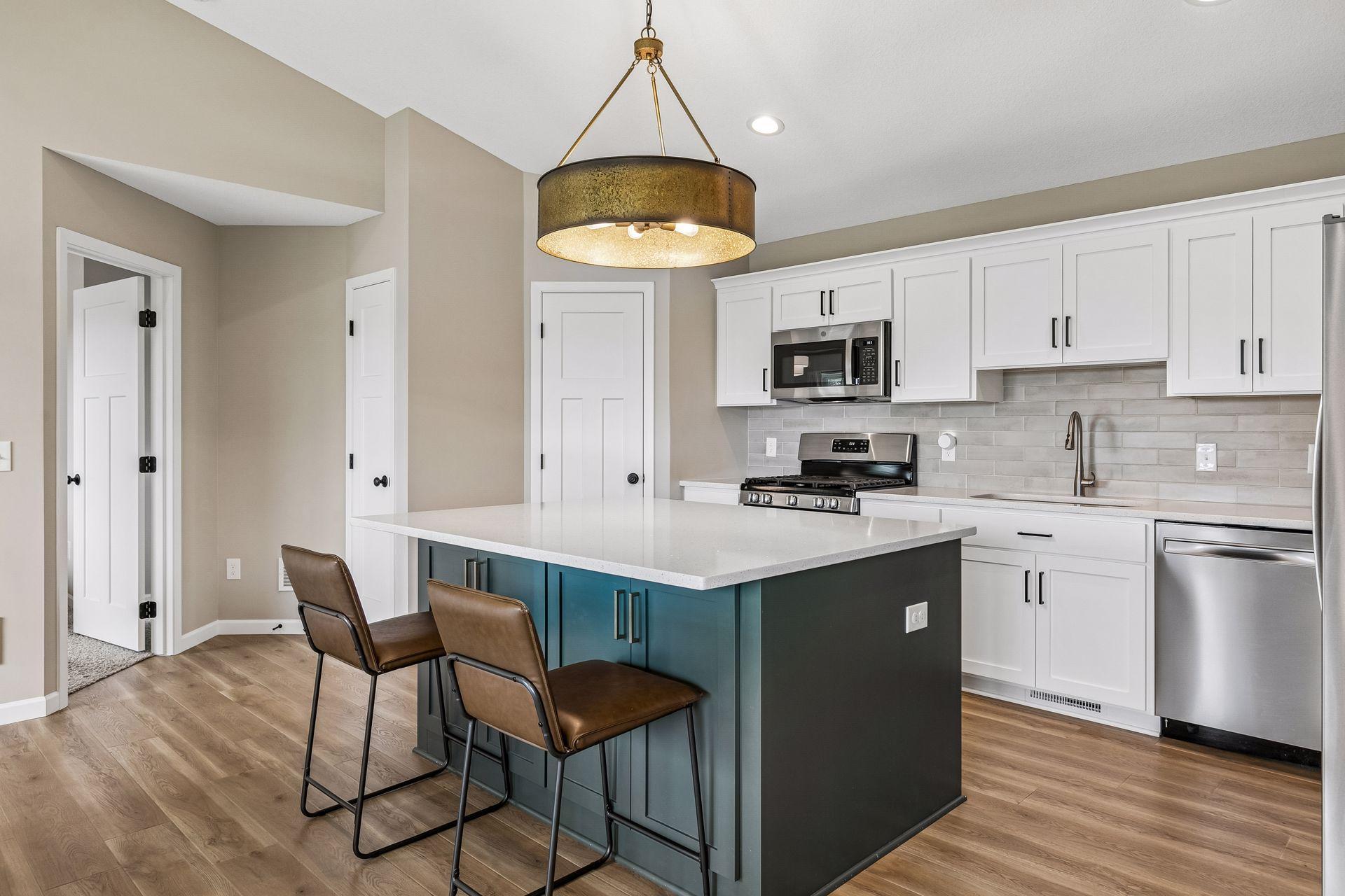 Beautiful kitchen with a center island. There is stainless steel appliances and nice cabinet storage in the center island!