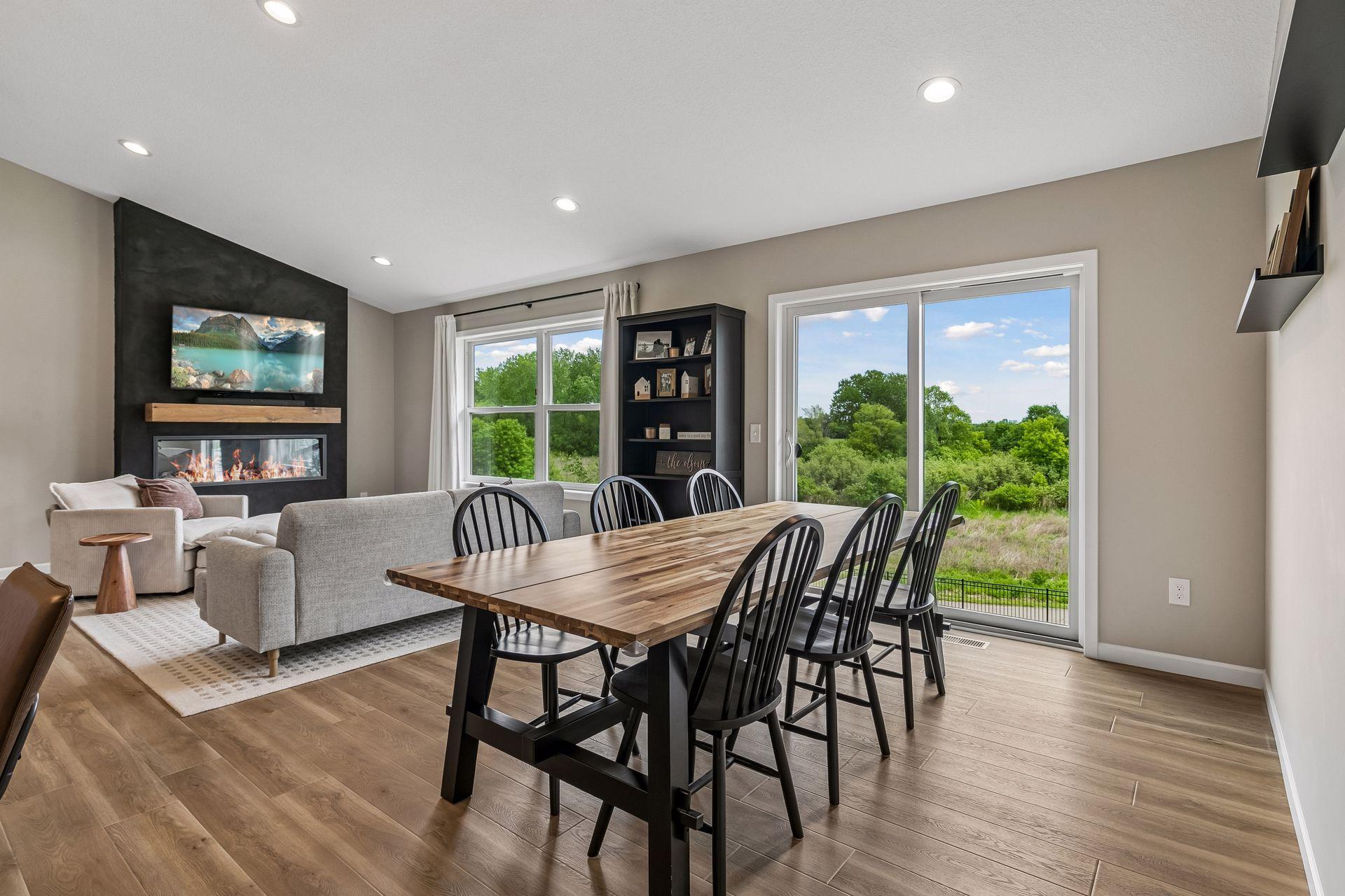 Views from your dining area that overlook your fenced in backyard that backs to woods and a walking path! With the possibilities to add a deck to go out to your backyard.