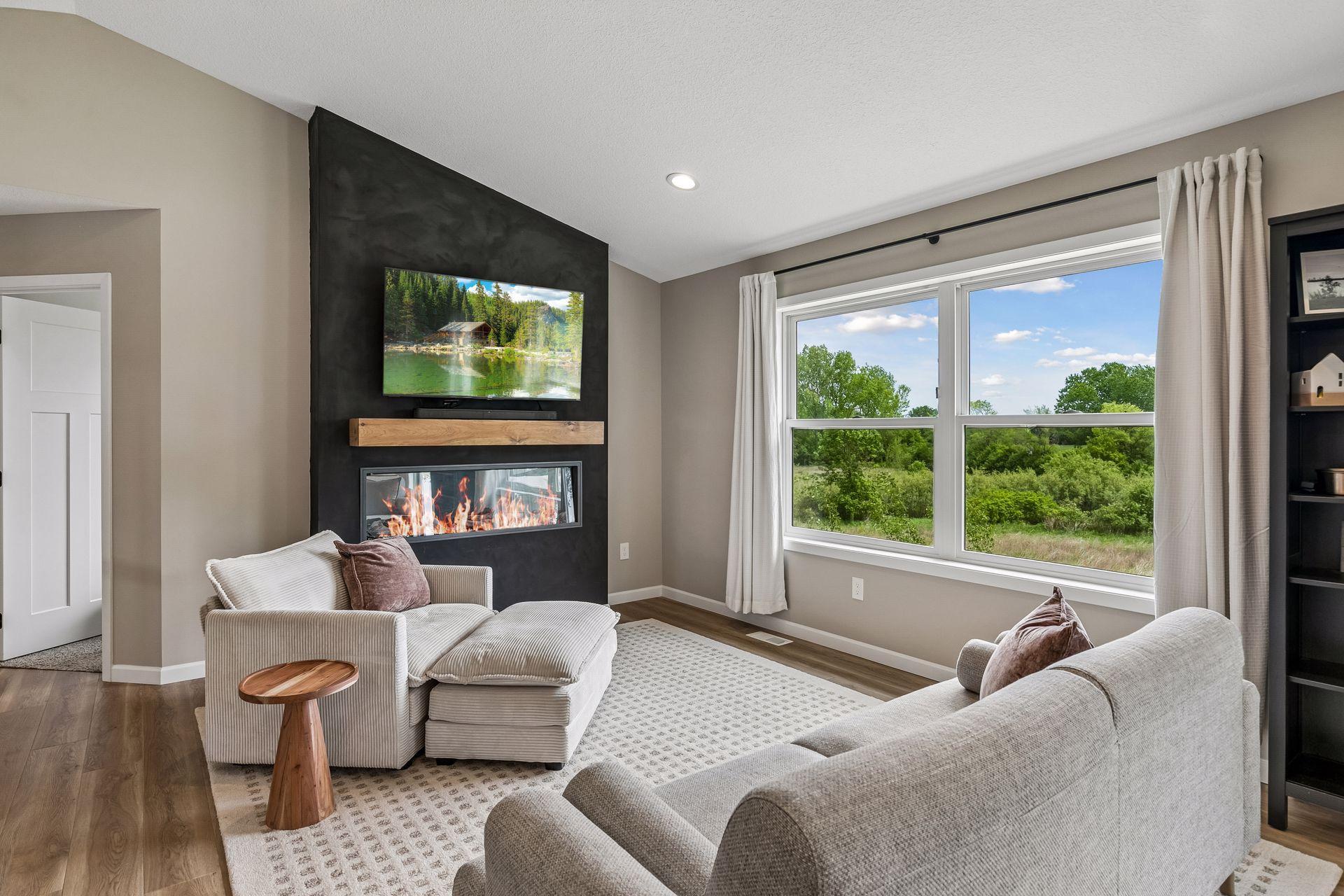 Cozy night upstairs with the fireplace and living area. This area receives great natural lighting as well.