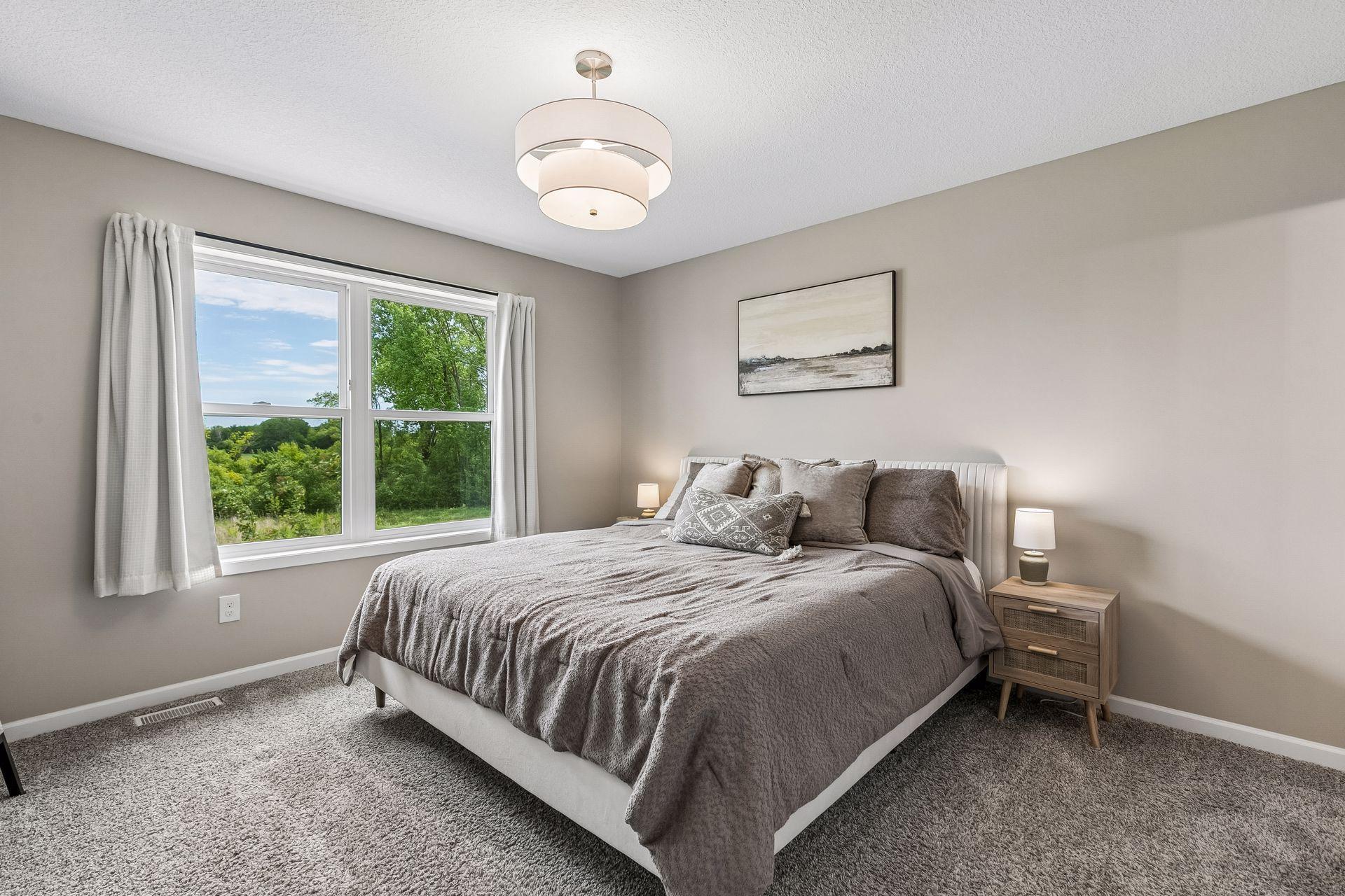 Primary bedroom that also receives great natural lighting. Very spacious and cozy.
