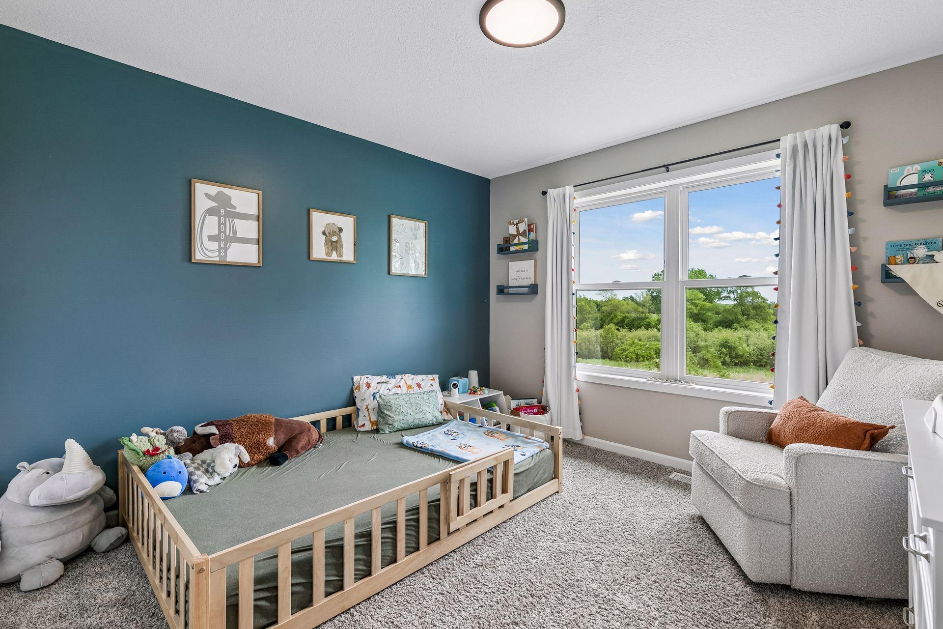 Bedroom #3 on the upper level. Inviting and great size to have multiple pieces of furniture if desired.