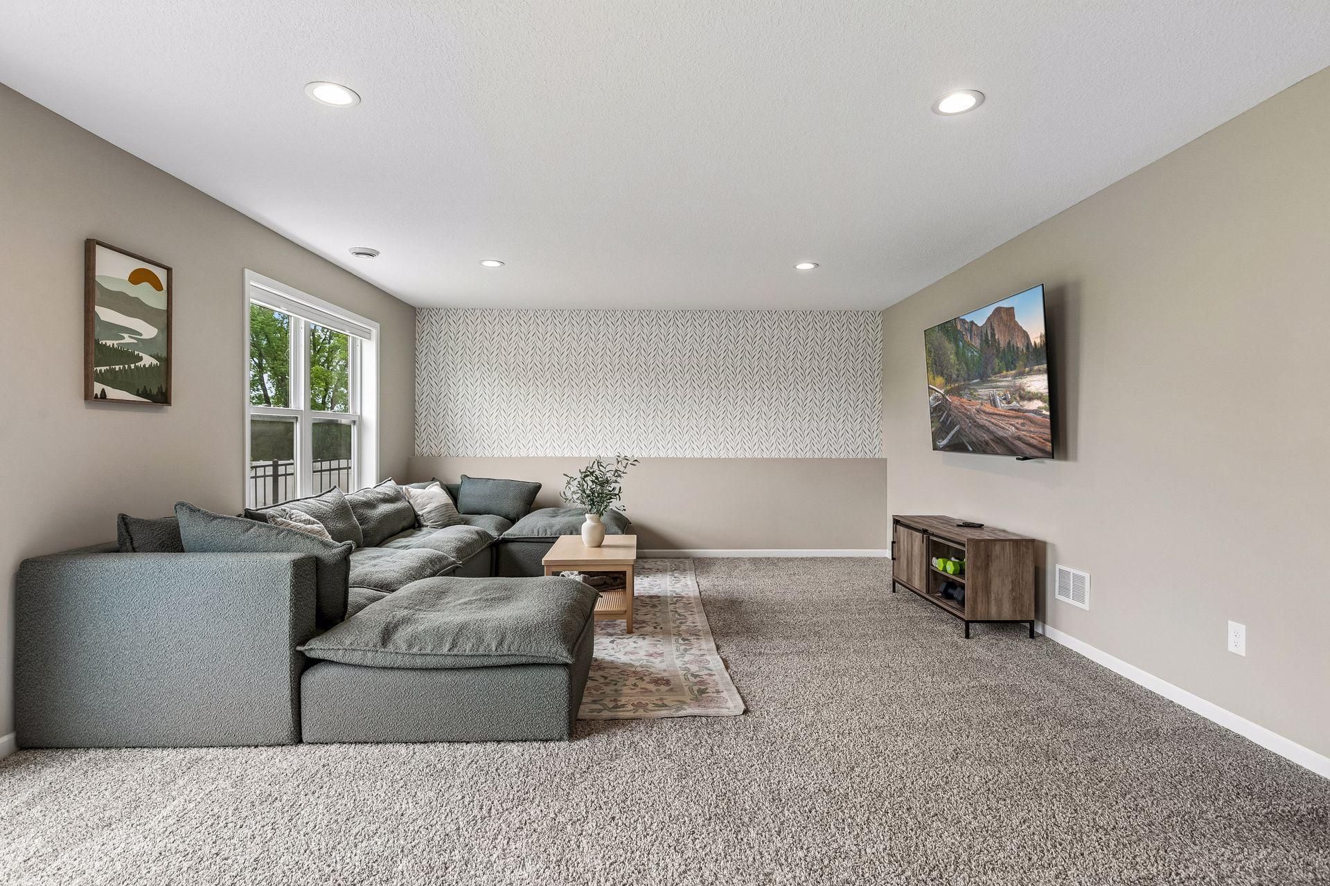Lower level also receives a generous amount of natural lighting.