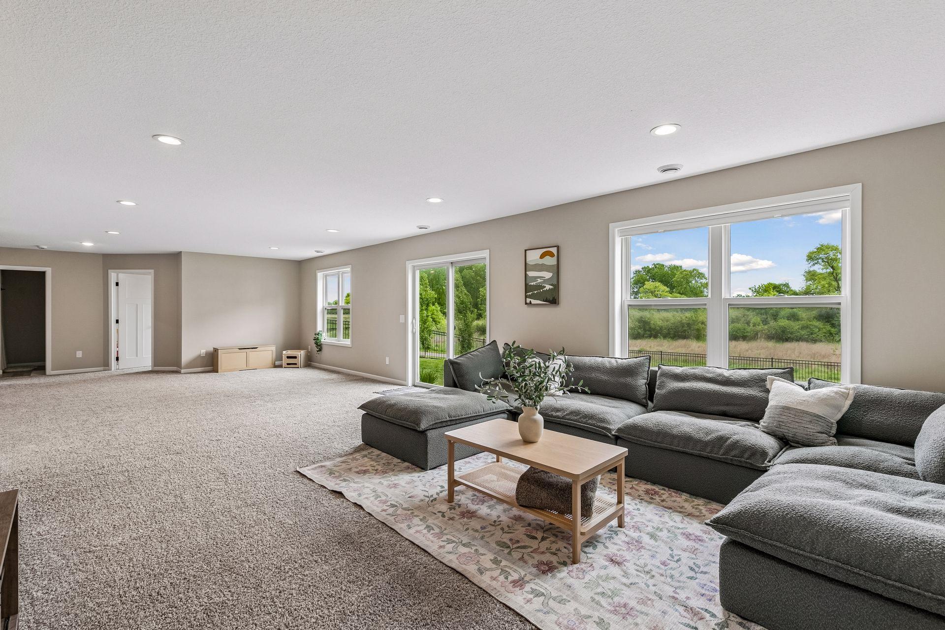 Generous space in the lower level. You can add whatever you want down in the space, tables, games, more seating, etc.