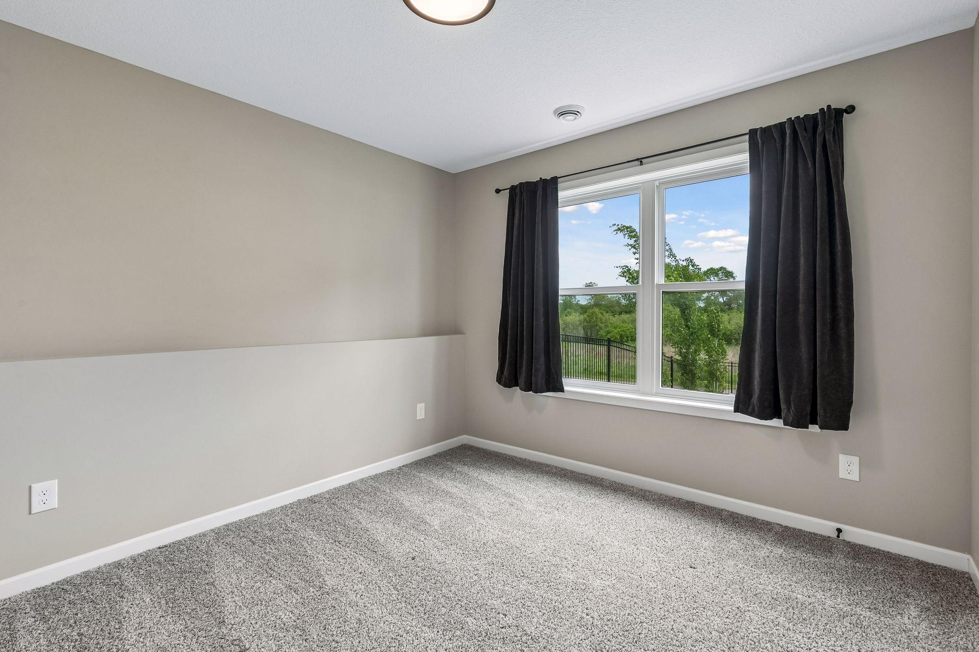 Bedroom #4 on the lower level. Very inviting lighting.
