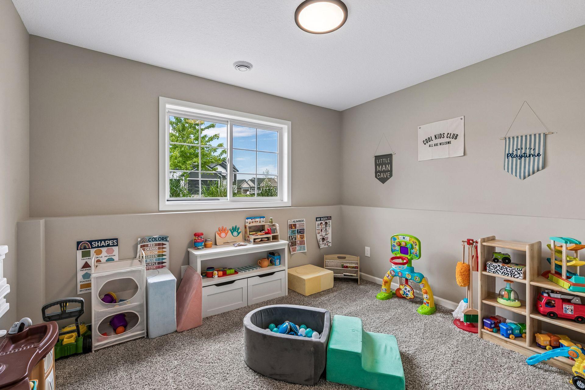 Bedroom #5 on lower level but used here as a playroom! Super cute space and use.