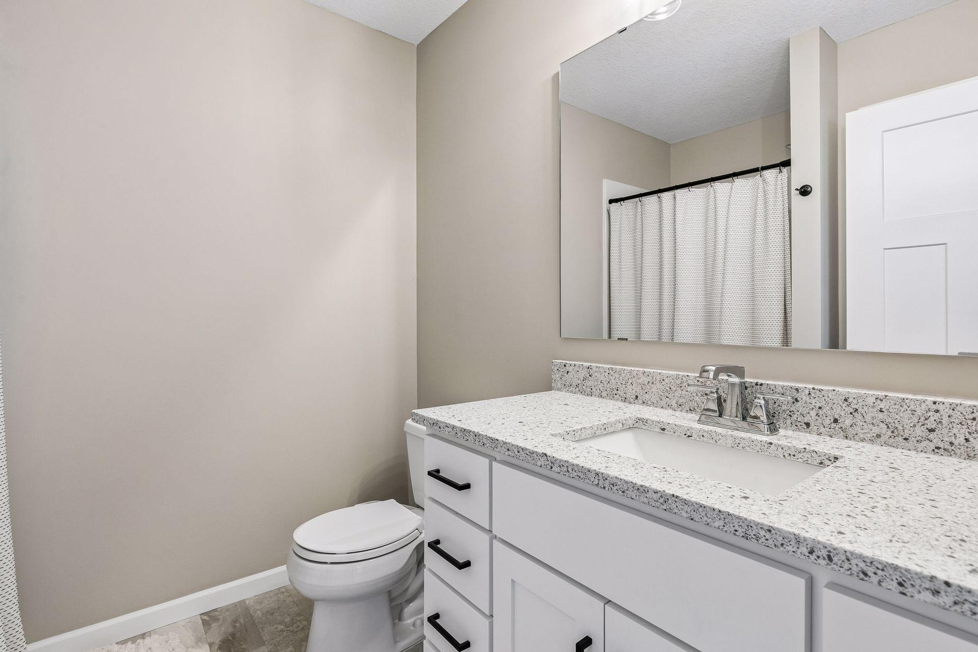 Bathroom that is on the lower level. Awesome for if guests are in town visiting you!