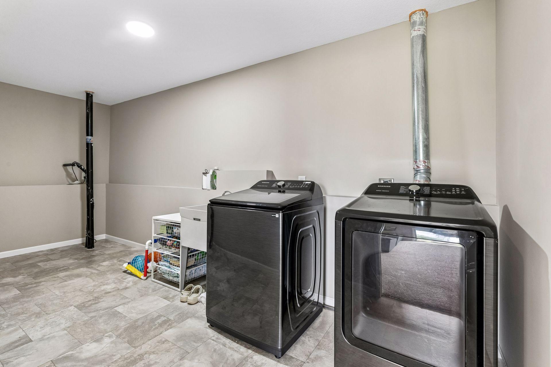 Laundry room that is on the lower level. Great washer and dryer.