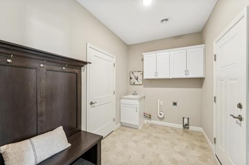Mudroom/Laundry Room - photos are of a staged home of similar floorplan, selections/colors may differ