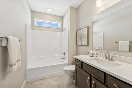 Front full bathroom - photos are of a staged home of similar floorplan, selections/colors may differ