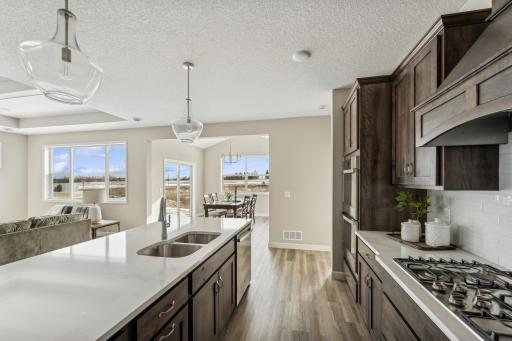 Kitchen - photos are of a staged home of similar floorplan, selections/colors may differ
