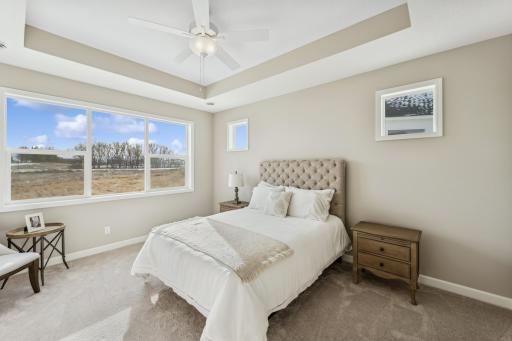 Primary suite - photos are of a staged home of similar floorplan, selections/colors may differ