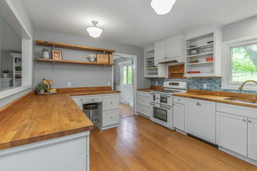 The farmhouse style kitchen offers loads of prep and storage space!