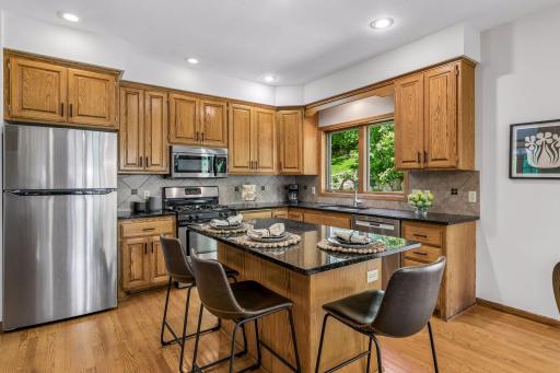 Large center isle offers a nice space to be part of the kitchen activities.