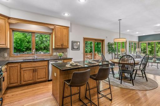 Custom cabinetry topped with granite, undermount sink and newer faucet. Newer dishwasher and fridge. All SS appliances.