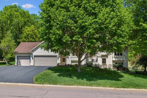 Front view from the street. Nicely landscaped with beautiful architectural detail!